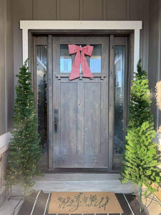 Red holiday bow on front door