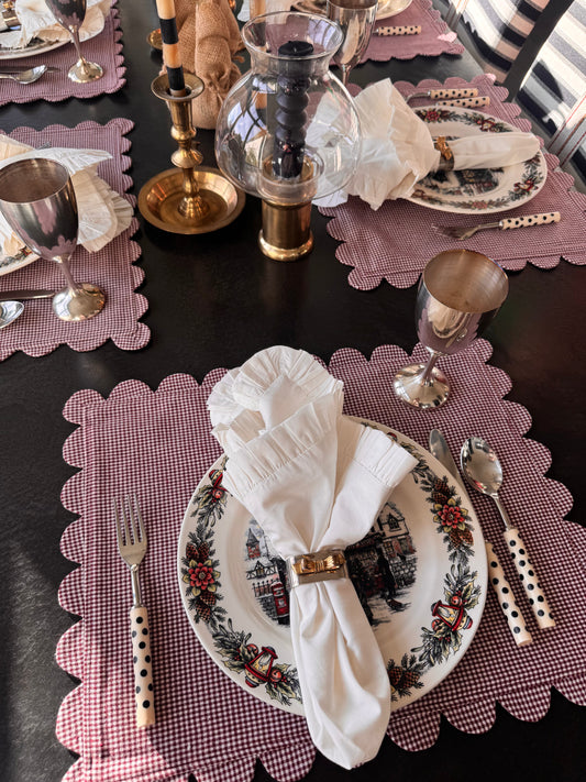 Holiday place setting with cranberry scalloped placemats, perfect for dining table décor and entertaining inspiration.