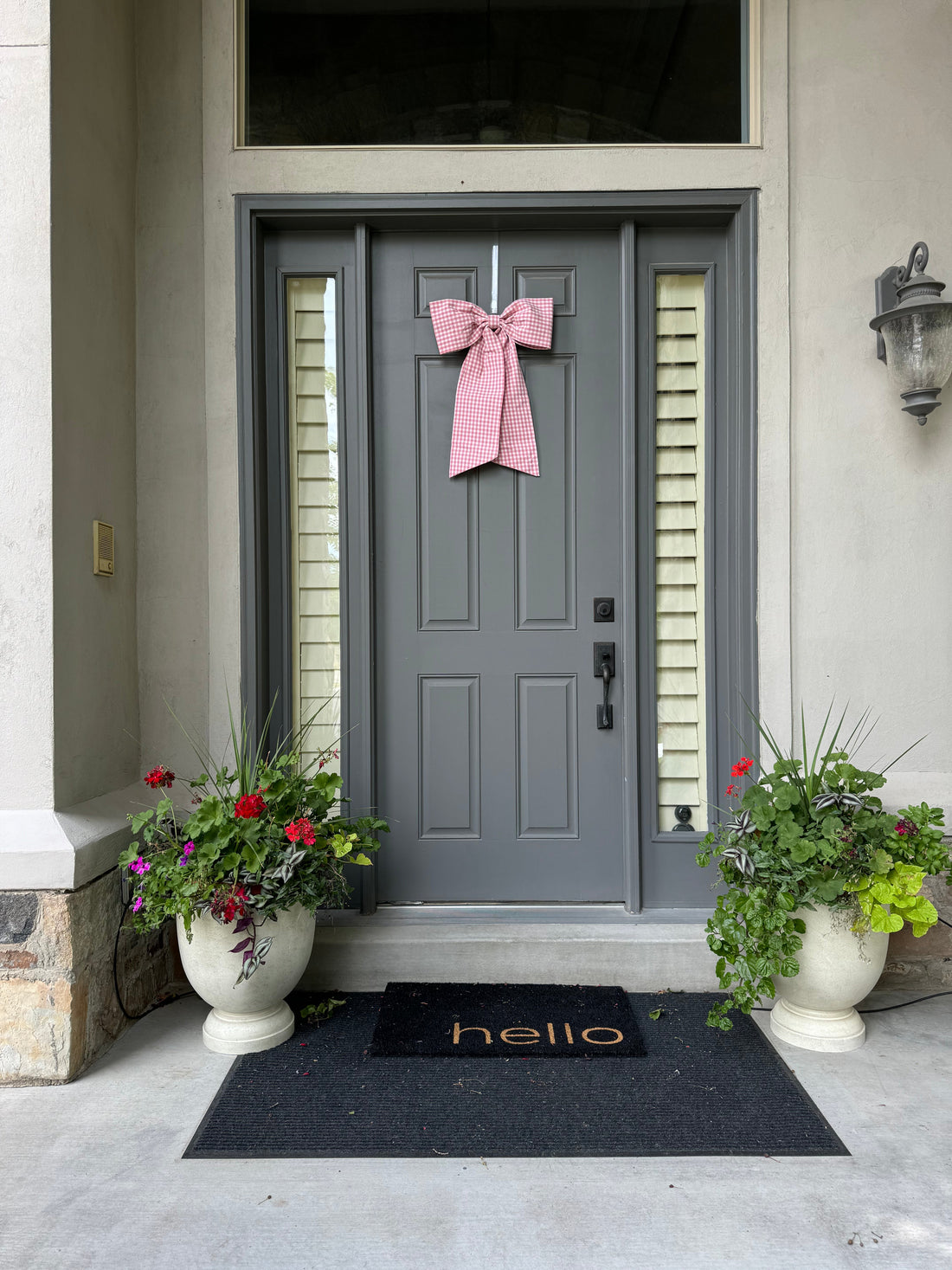 Pink front door bow on grey front door