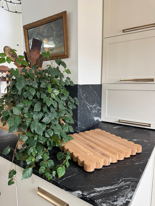 Elevate your kitchen with the Scalloped Oak Cutting Board