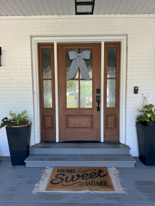 Black door bow on front door