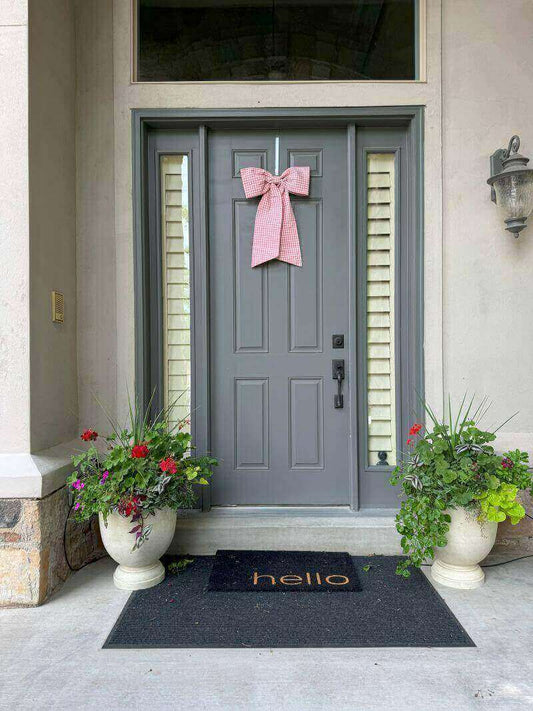 pink gingham bow on grey blue front door