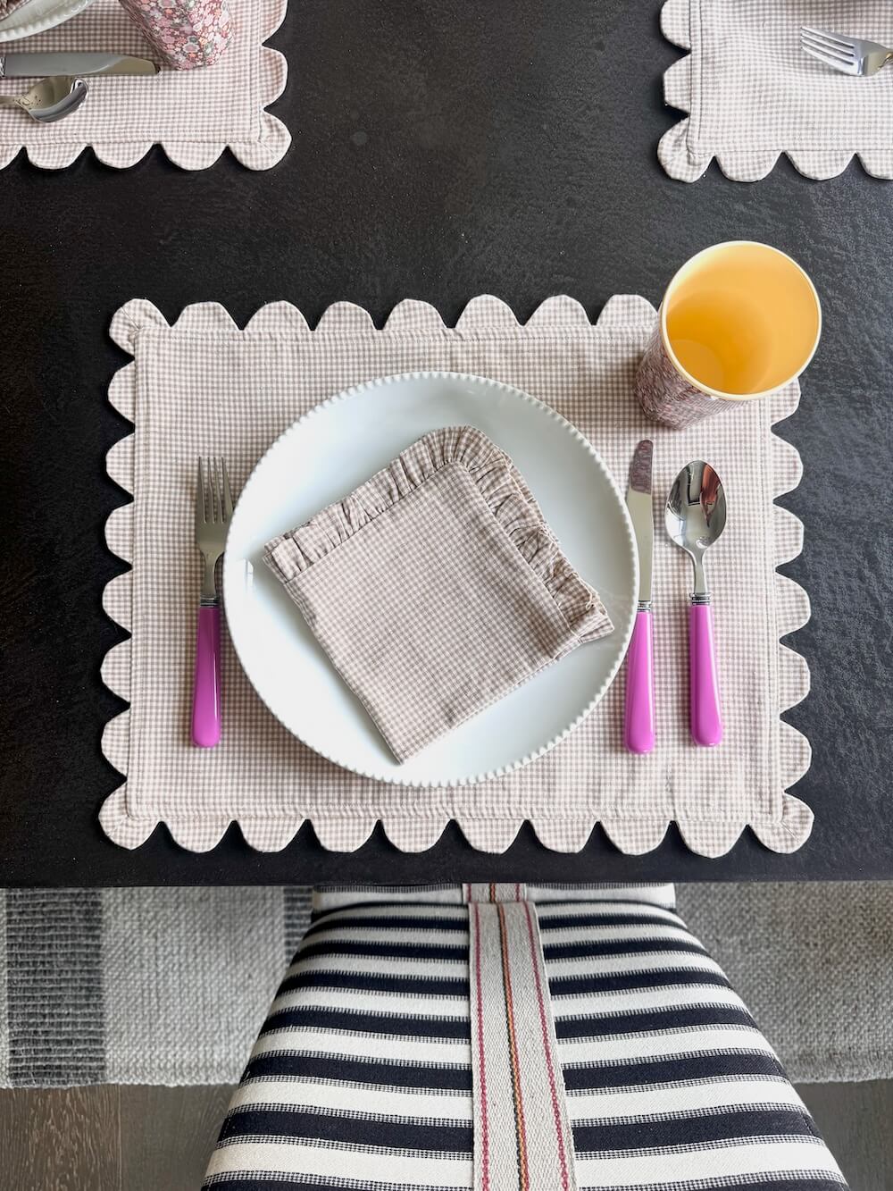 Table seating set with cream gingham placemat and cream gingham dish towel